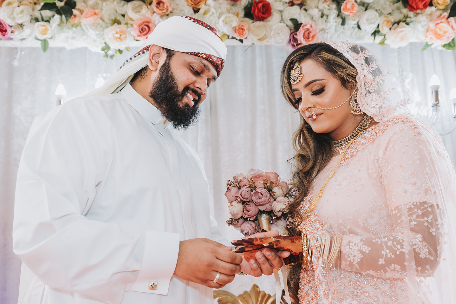 Hamida and Sahid exchanging rings during their wedding near Andover