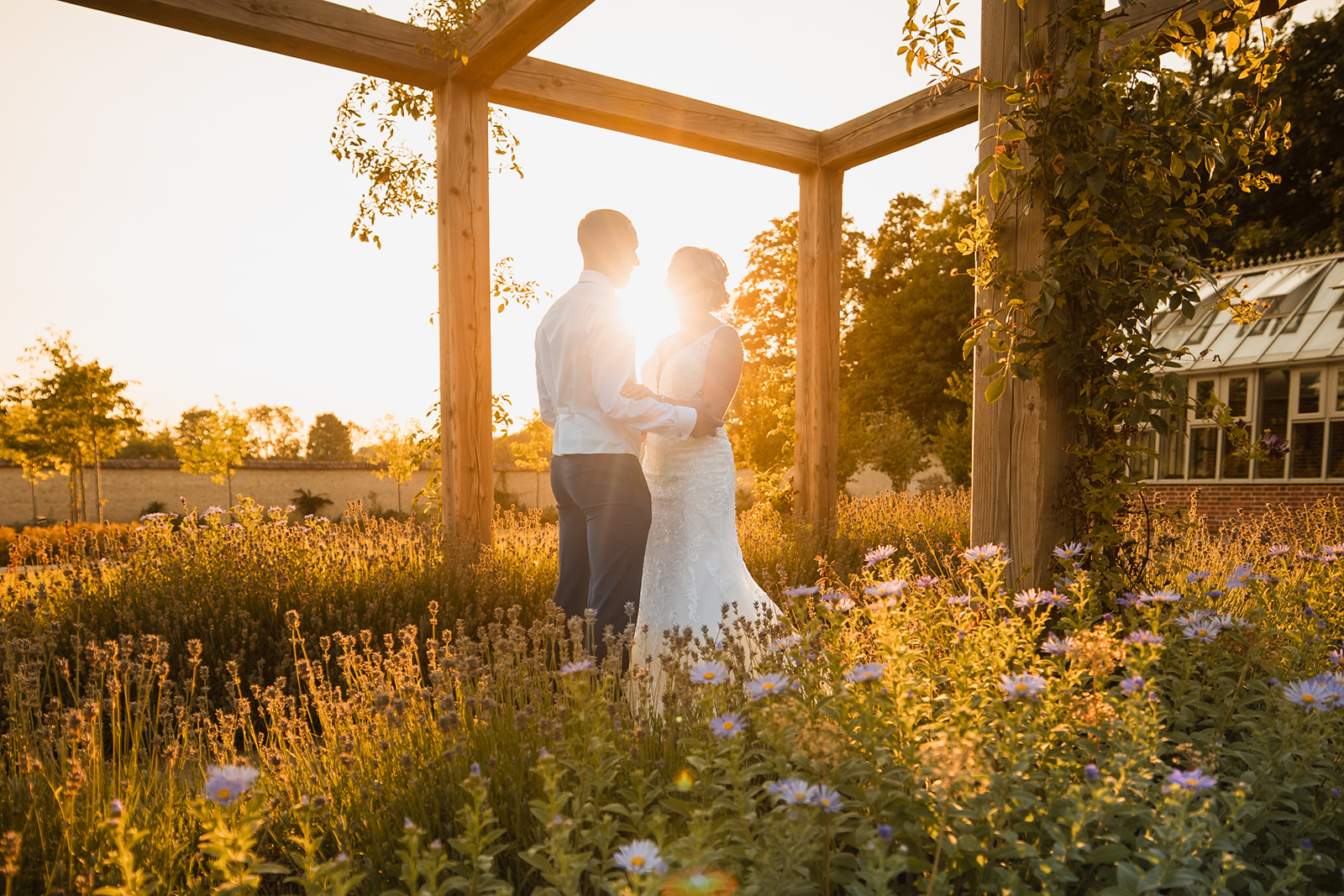 Vicky and Kevin sharing a golden hour portrait during their wedding at Syrencot in Wiltshire.