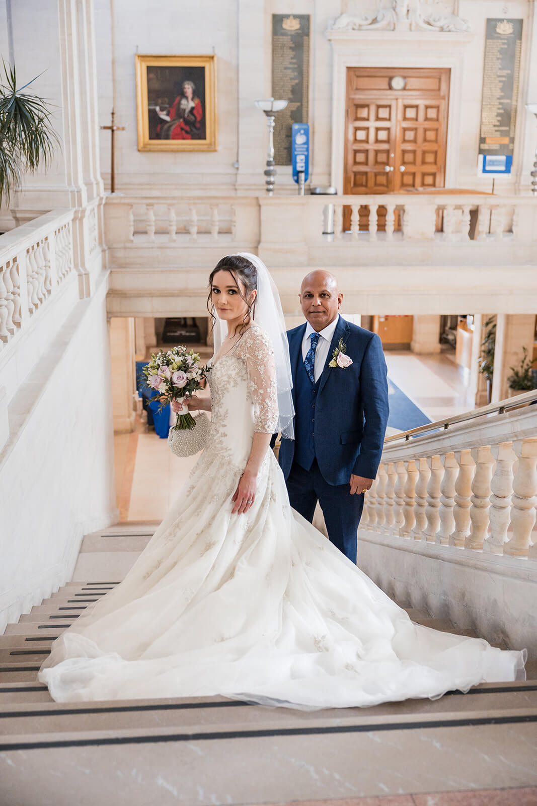 Lenka and Raj on the staircase after their ceremony at Southampton Civic Centre