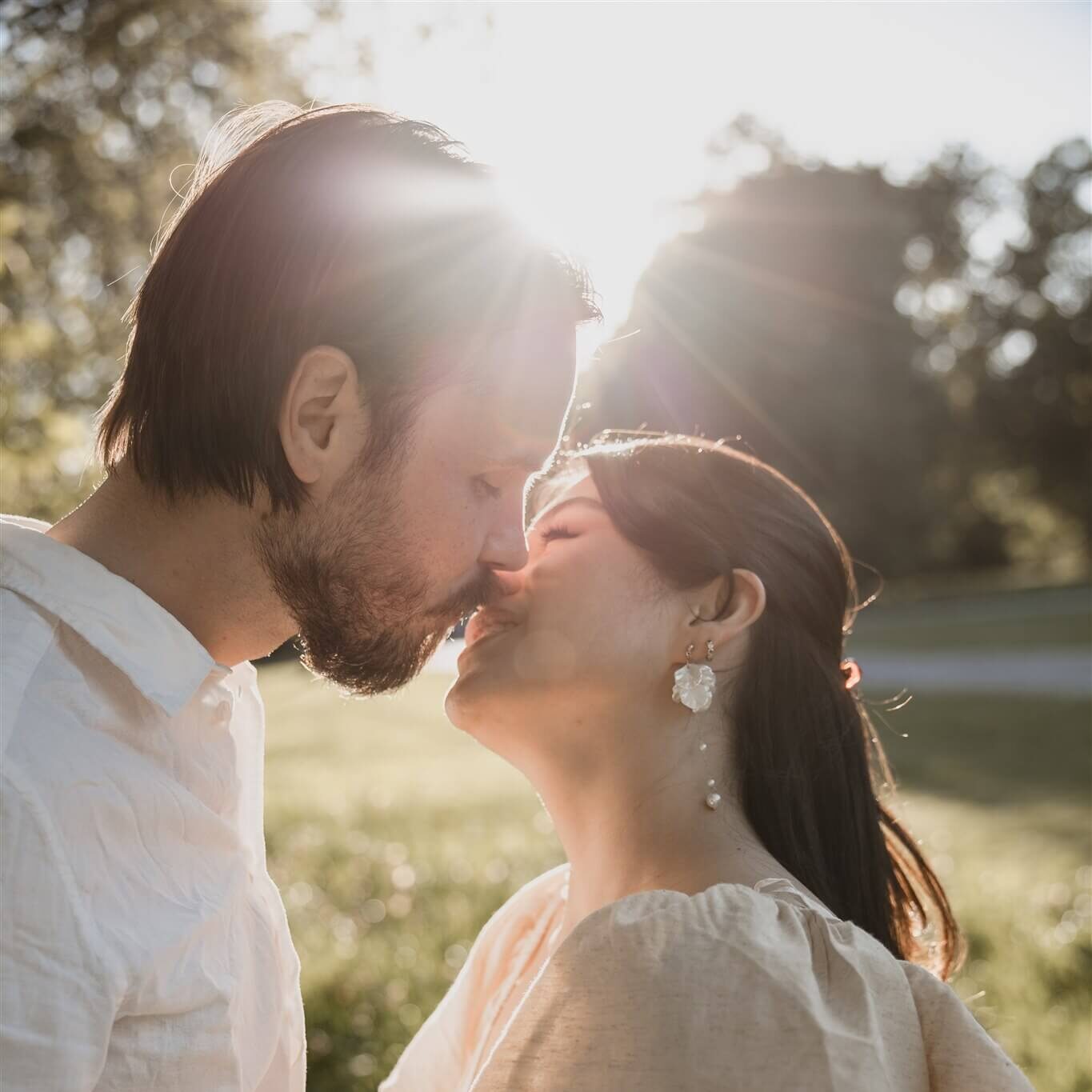 Karen and Anton sharing a kiss during their engagement photoshoot in London.